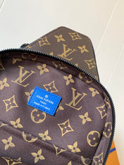 AVENUE SLINGBAG 31 IN BLUE AND BROWN TAIGA LEATHER