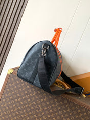LV 25S KEEPALL 45 WITH SHOULDER STRAP IN BLACK ORANGE COATED MONOGRAM ECLIPSE CANVAS AND CALFSKIN