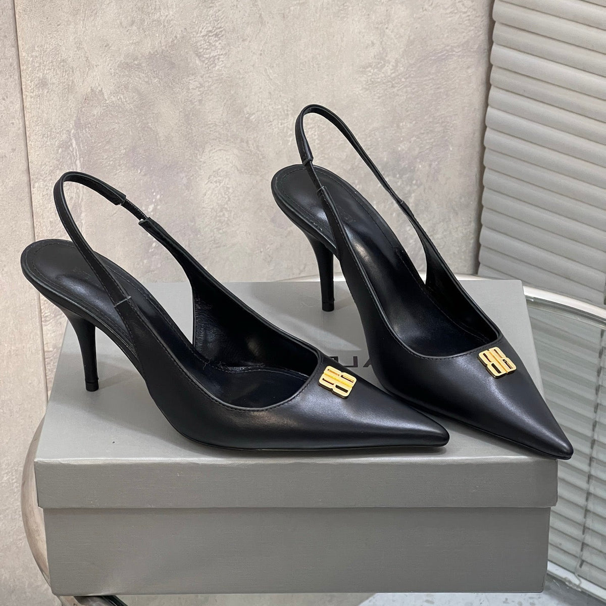 BALENCIAGA 25S HIGH-HEEL SLINGBACK 85 MM IN BLACK COW LEATHER WITH GOLD HARDWARE