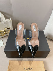 ALAIA HIGH MULES IN BLACK PATENT CALFSKIN AND FILM