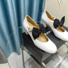 HIGH MARY JANE SHOES WHITE SHEEPSKIN WITH BLACK BOW