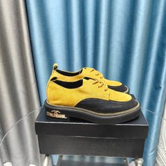 OXFORD SHOES IN GOLD YELLOW SUEDE AND BLACK SHEEPSKIN