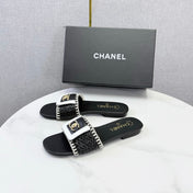 CHANEL 26S WOVEN STRAP SLIDES IN BLACK LAMBSKIN