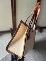 CABAS 37 IN WHITE CANVAS AND BRONZE BROWN CALFSKIN TRIM GOLD LOCK