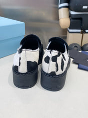 PRADA 26S LOAFERS IN WHITE AND BLACK COW PRINT PONY HAIR