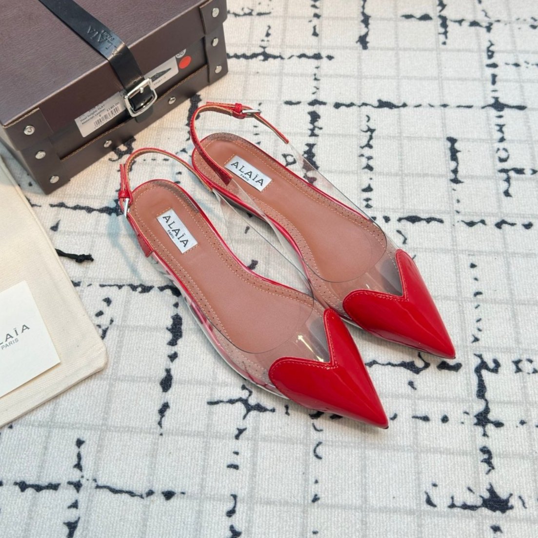 ALAIA FLAT SLINGBACK IN CHERRY RED PATENT CALFSKIN AND FILM