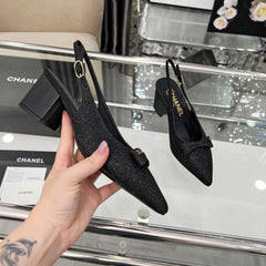 CHANEL 25S SANDALS WITH A BOW 60MM IN SPARKLING BLACK CANVAS