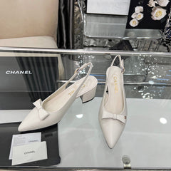 CHANEL 25S SANDALS WITH A BOW 60MM IN WHITE CALFSKIN