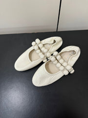 ALAIA SPHERE BALLET FLATS IN WHITE LAMBSKIN