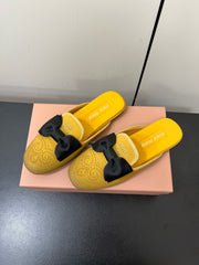 BOW MULES IN DUST YELLOW SUEDE