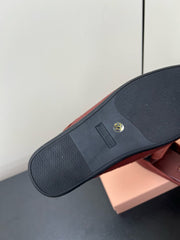 BOW MULES IN RED BROWN SHEEPSKIN