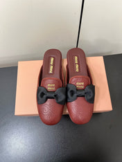 BOW MULES IN RED BROWN SHEEPSKIN