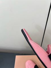 BOW MULES IN PINK SHEEPSKIN