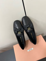 LOAFERS WITH BOW IN BLACK SHEEPSKIN