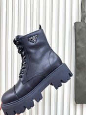 PRADA 25S MONOLITH BOOTS IN BLACK CALFSKIN