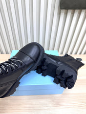 PRADA 25S MONOLITH BOOTS IN BLACK CALFSKIN
