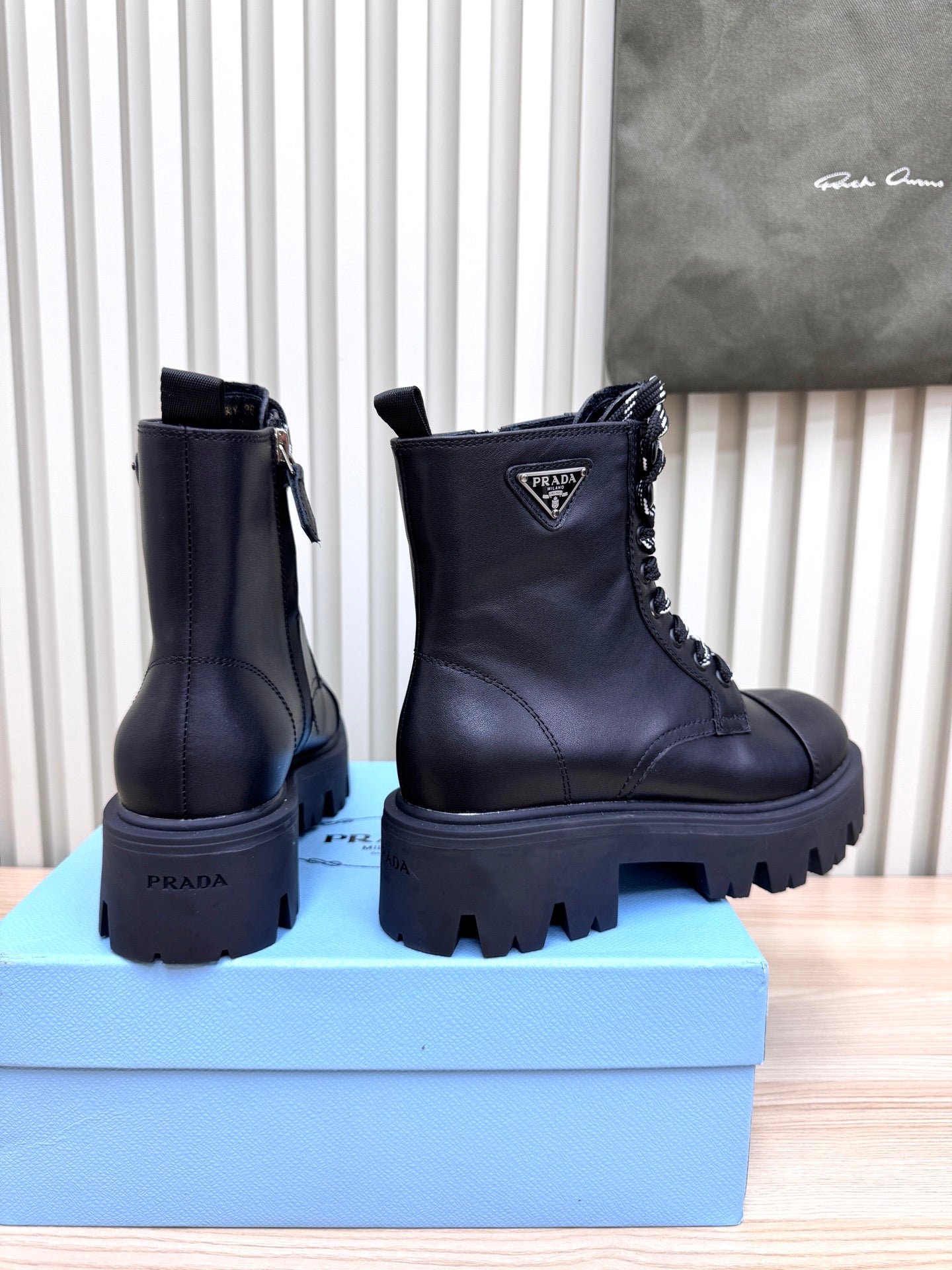 PRADA 25S MONOLITH BOOTS IN BLACK CALFSKIN