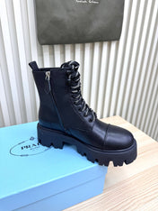 PRADA 25S MONOLITH BOOTS IN BLACK CALFSKIN