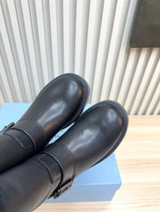 PRADA 25S MARTIN BOOTS IN BLACK CALFSKIN FUR-LINED