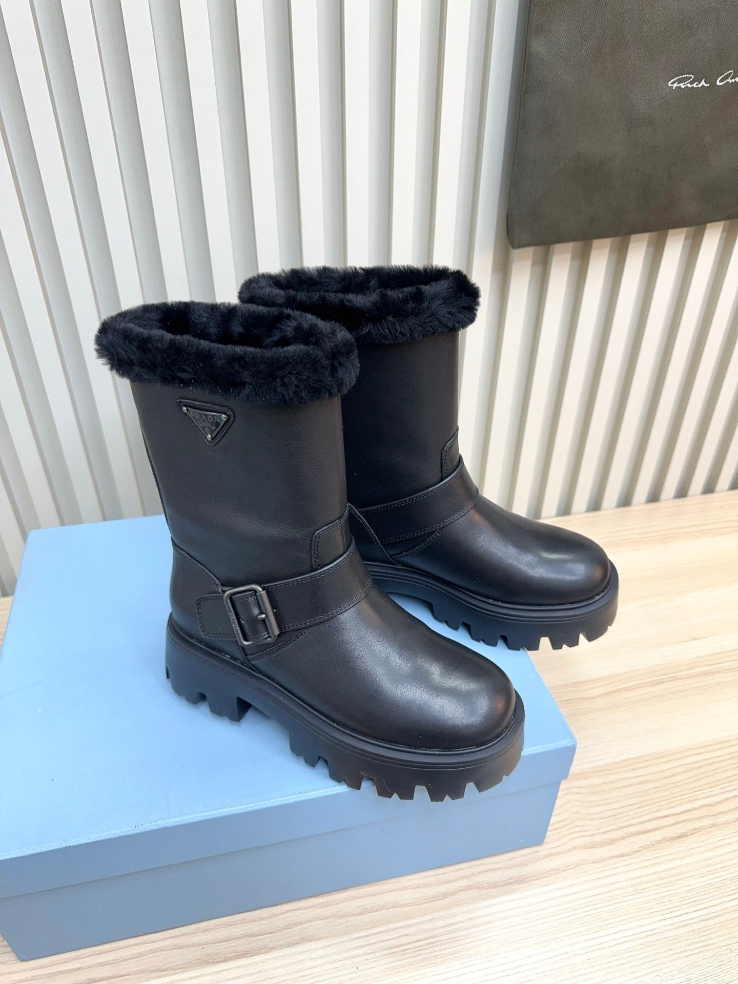 PRADA 25S MARTIN BOOTS IN BLACK CALFSKIN FUR-LINED