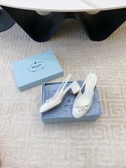 TRIANGLE LOGO SLINGBACK PUMPS WITH BOW IN WHITE CALFSKIN