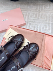 BOW MARY JANE FLAT IN ESPRESSO NAPLAK LAMBSKIN