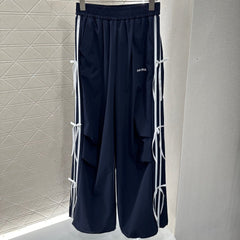 MIUMIU HIGH-WAISTED WIDE-LEG PANTS WITH BOW 276652