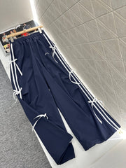 MIUMIU HIGH-WAISTED WIDE-LEG PANTS WITH BOW 276652