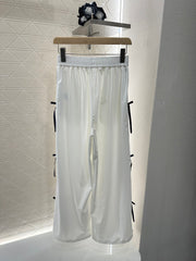 MIUMIU HIGH-WAISTED WIDE-LEG PANTS WITH BOW 276654