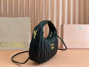 WANDER MATELASSÉ HANDBAG 23 IN BLACK LAMBSKIN