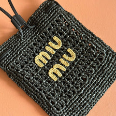 WANDER BUCKET BAG 23 BLACK IN RAFFIA WITH LEATHER TRIM