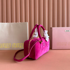 ARCADIE BAG 27 IN FUCHSIA SUEDE GOLD HARDWARE