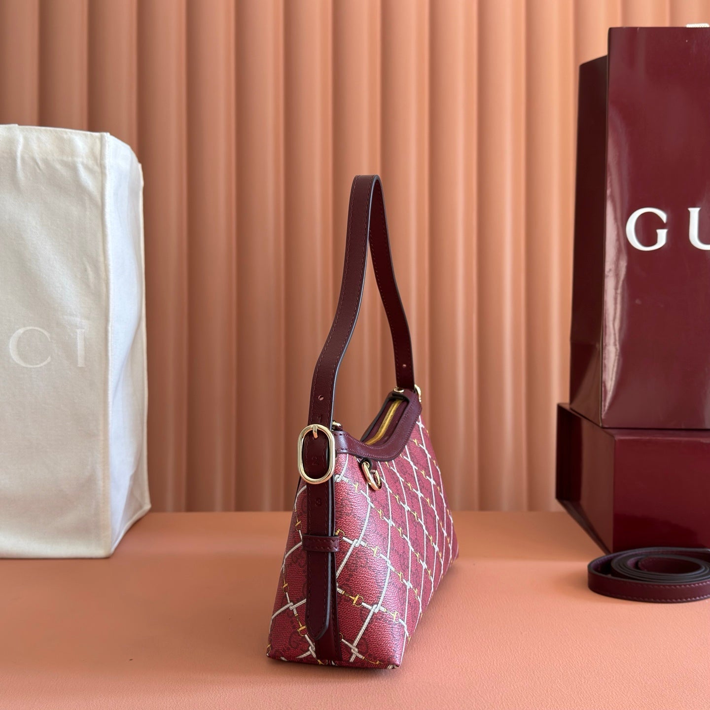 GUCCI 26S GG EMBLEM BUCKET BAG 22 IN DARK RED COATED FABRIC