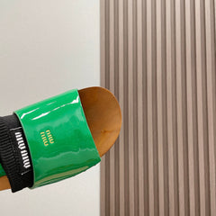 SLIPPERS IN GREEN GLOSSY CALFSKIN WITH BLACK HALF-FOOT SOCKS