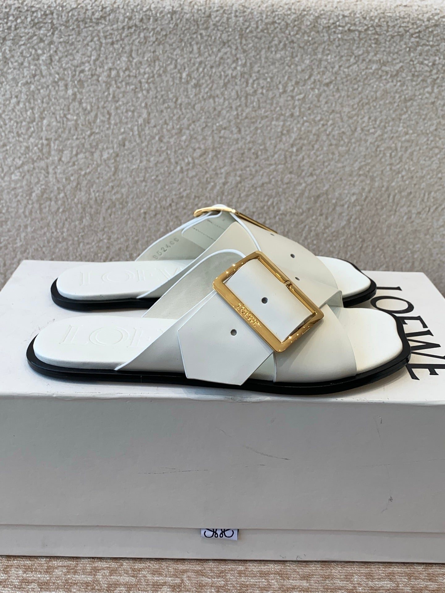 PETAL BELT FLAT SANDAL IN WHITE CALFSKIN