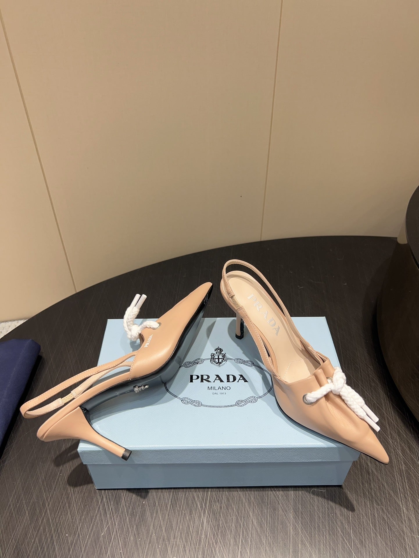PRADA 25S POINTED TOE SLINGBACK 85MM IN BEIGE LAMBSKIN WITH TIE UP DESIGN