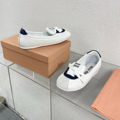 White Leather Ballet Flats With Black