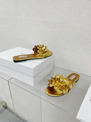 ALAIA FLAT MULE IN GOLDEN GLOSSY LAMBSKIN