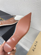 ALAIA LE COEUR FLAT SLINGBACKS IN WHITE PATENT LAMBSKIN