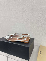 ALAIA LE COEUR FLAT SLINGBACKS IN WHITE PATENT LAMBSKIN