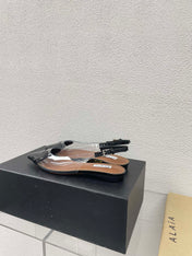 ALAIA LE COEUR FLAT SLINGBACKS IN BLACK PATENT LAMBSKIN