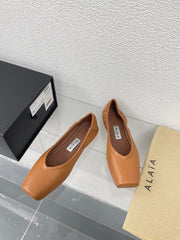 ALAIA BALLET FLATS IN COPPER BROWN CALFSKIN