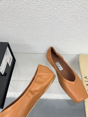 ALAIA BALLET FLATS IN COPPER BROWN CALFSKIN