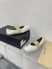 ALAIA MARY JANE PEARL IN GLOSSY WHITE LAMBSKIN