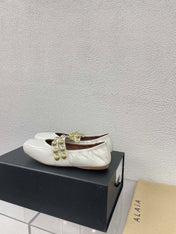 ALAIA MARY JANE PEARL IN GLOSSY WHITE LAMBSKIN