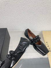 ALAIA MARY JANE PEARL IN GLOSSY BLACK LAMBSKIN