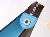 LV 25S POCHETTE VOYAGE 26 IN GASTON BLUE MONOGRAM MACASSAR COATED CANVAS