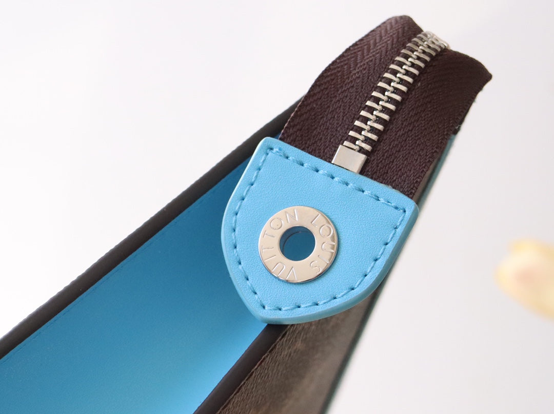 LV 25S POCHETTE VOYAGE 26 IN GASTON BLUE MONOGRAM MACASSAR COATED CANVAS