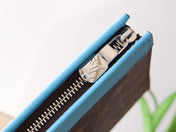 LV 25S POCHETTE VOYAGE 26 IN GASTON BLUE MONOGRAM MACASSAR COATED CANVAS