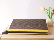 LV 25S POCHETTE VOYAGE 26 IN YELLOW MONOGRAM MACASSAR COATED CANVAS